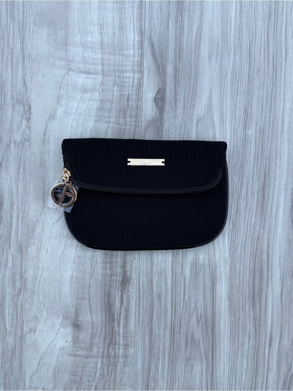Giorgio Armani Parfumes black ribbed pouch.